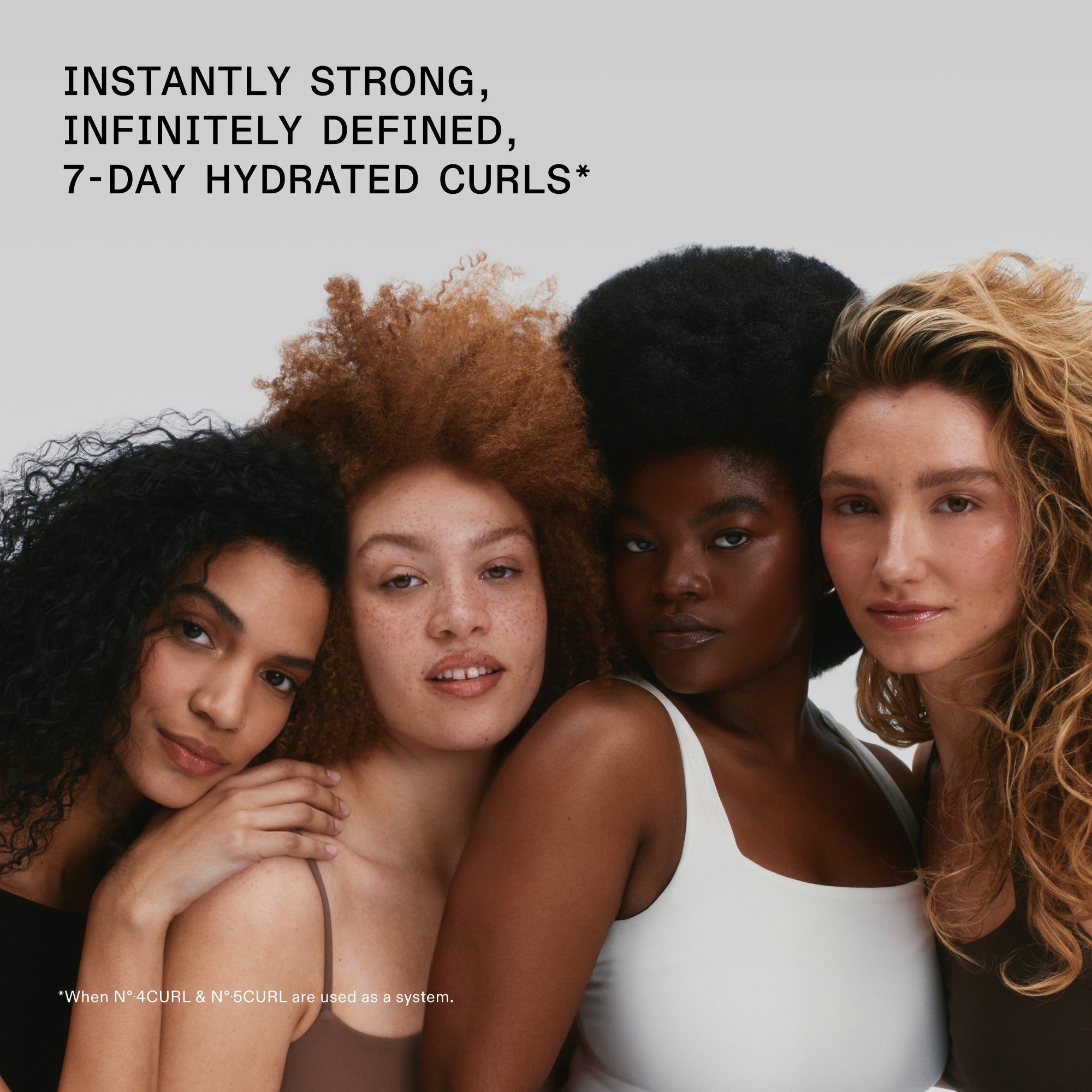 Four women with diverse curly and coiled hair textures posing together. Text reads: INSTANTLY STRONG, INFINITELY DEFINED, 7-DAY HYDRATED CURLS. A footnote at the bottom adds: When Nº.4CURL and Nº. 5CURL are used as a system