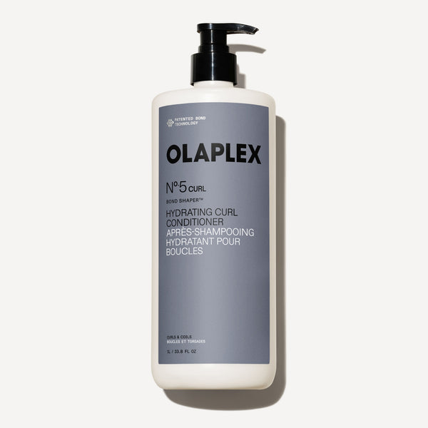 Botella de 1000 ml de Olaplex Nº.5CURL Bond Shaper Hydrating Curl Conditioner sobre un fondo blanco liso. - main view